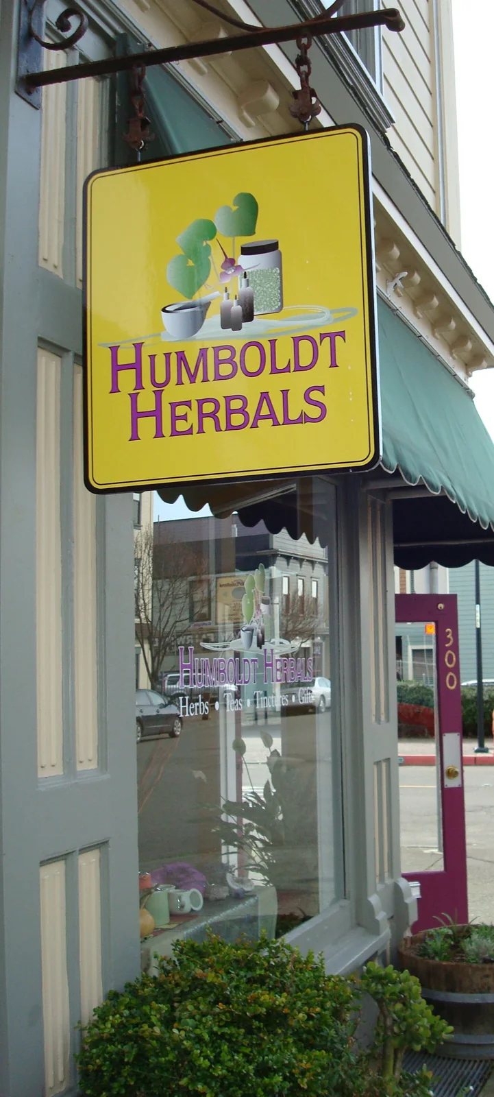 Humboldt Herbals hanging sign outside the shop at 300 2nd Street
