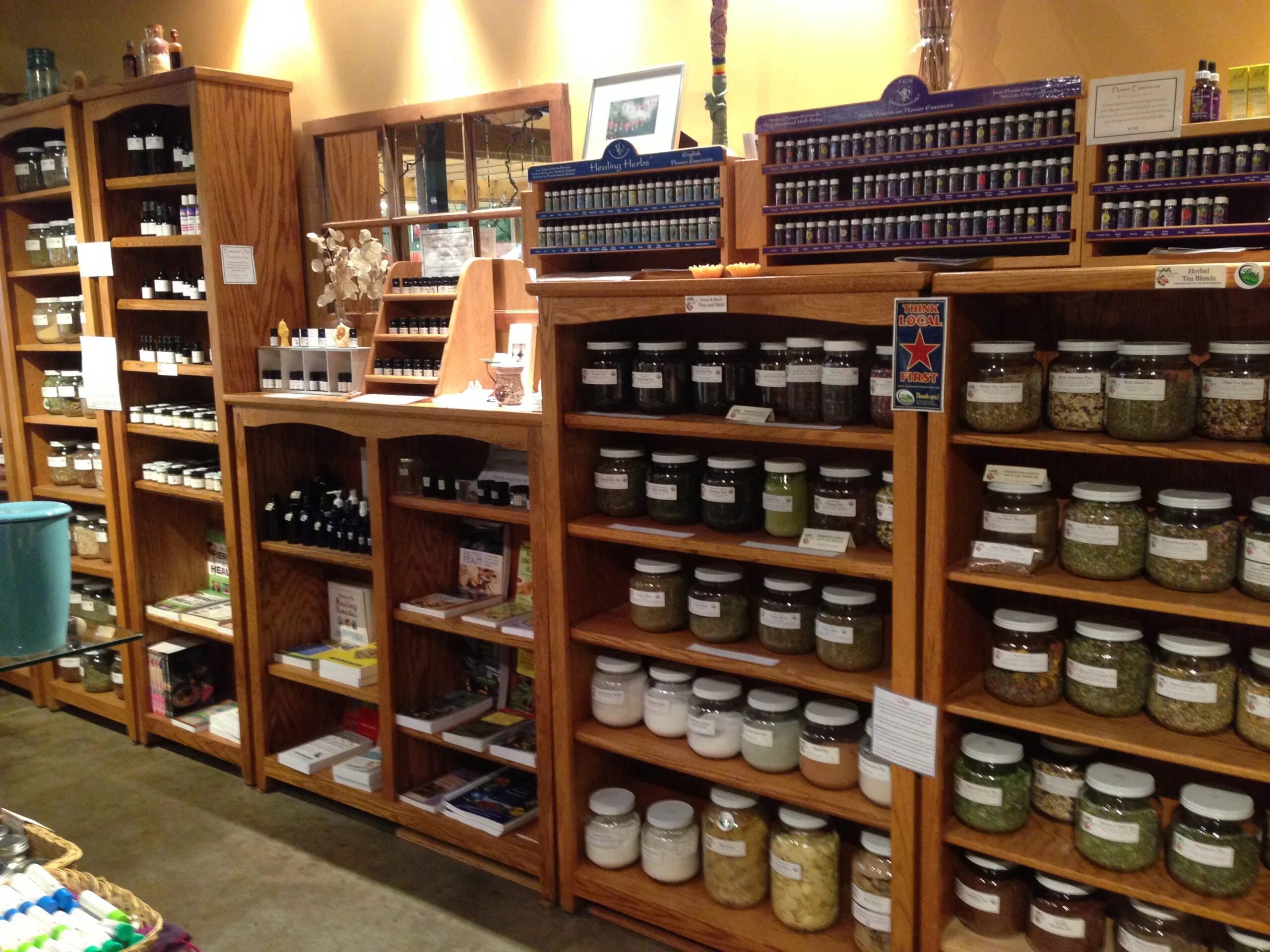 Bulk herbs and wooden shelves inside Living Earth Herbs