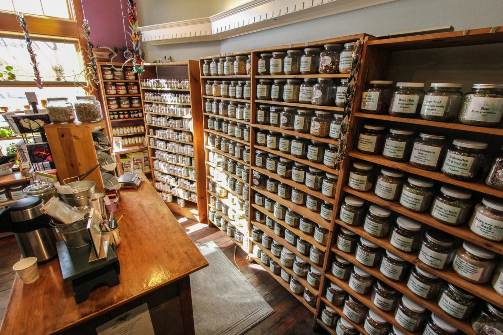 Rows of bulk herb jars inside Meadowsweet Herbs