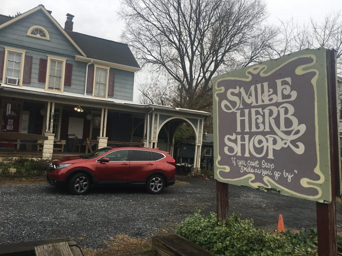 Smile Herb Shop house and hand-painted sign on Berwyn Road