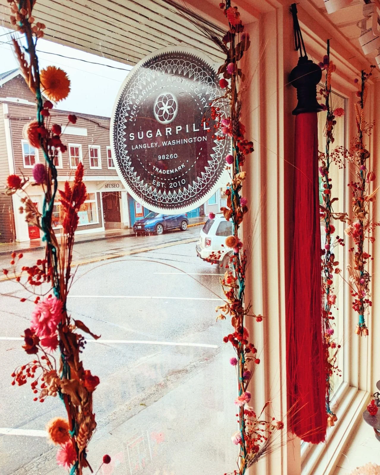 SugarPill shop window and hanging sign in Langley