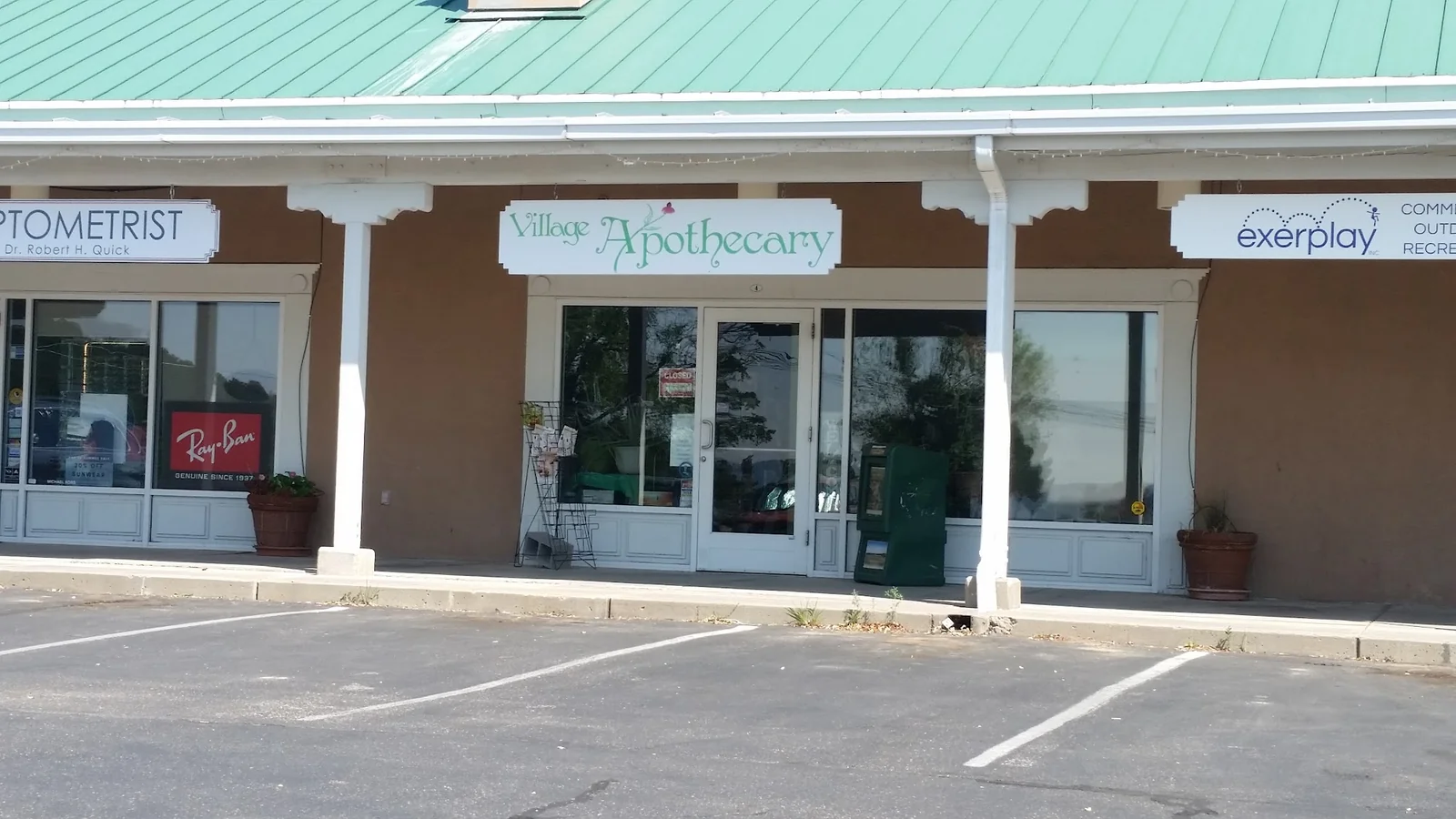 Village Apothecary storefront in Cedar Crest with its named sign over the entrance