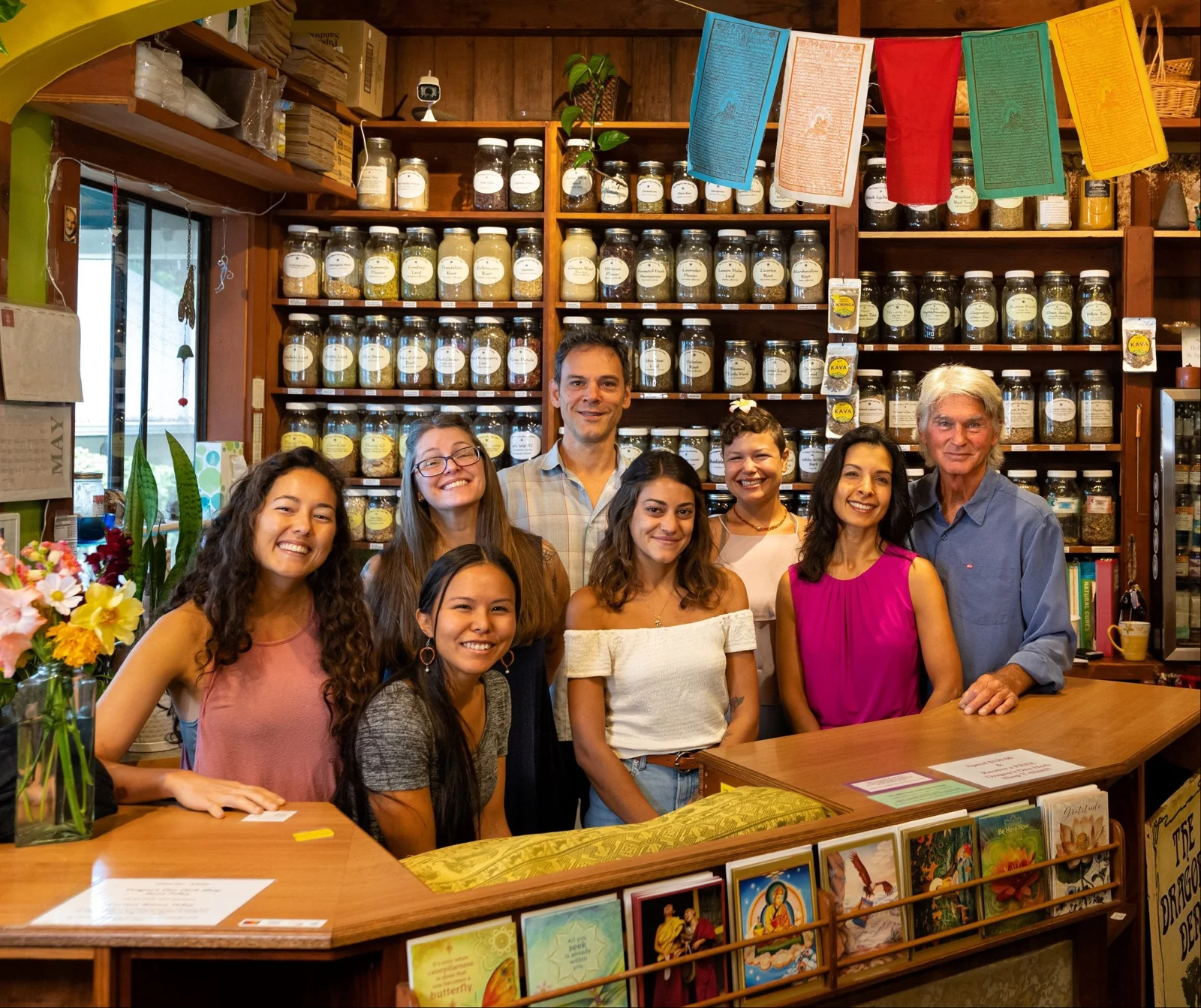 Dragon’s Den Herb Shop team behind the counter