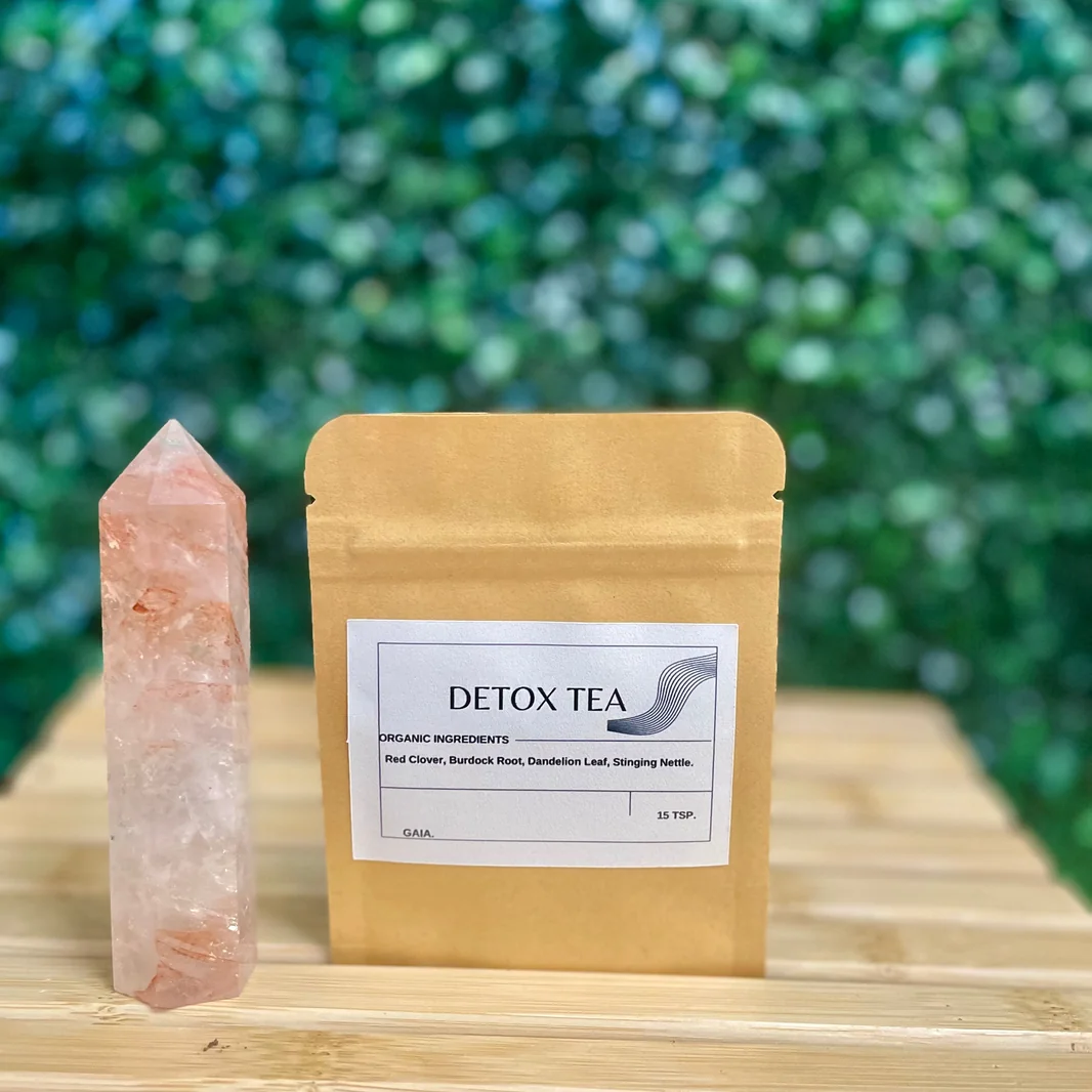 Gaia Emporium herbal tea pouch photographed beside a rose quartz crystal