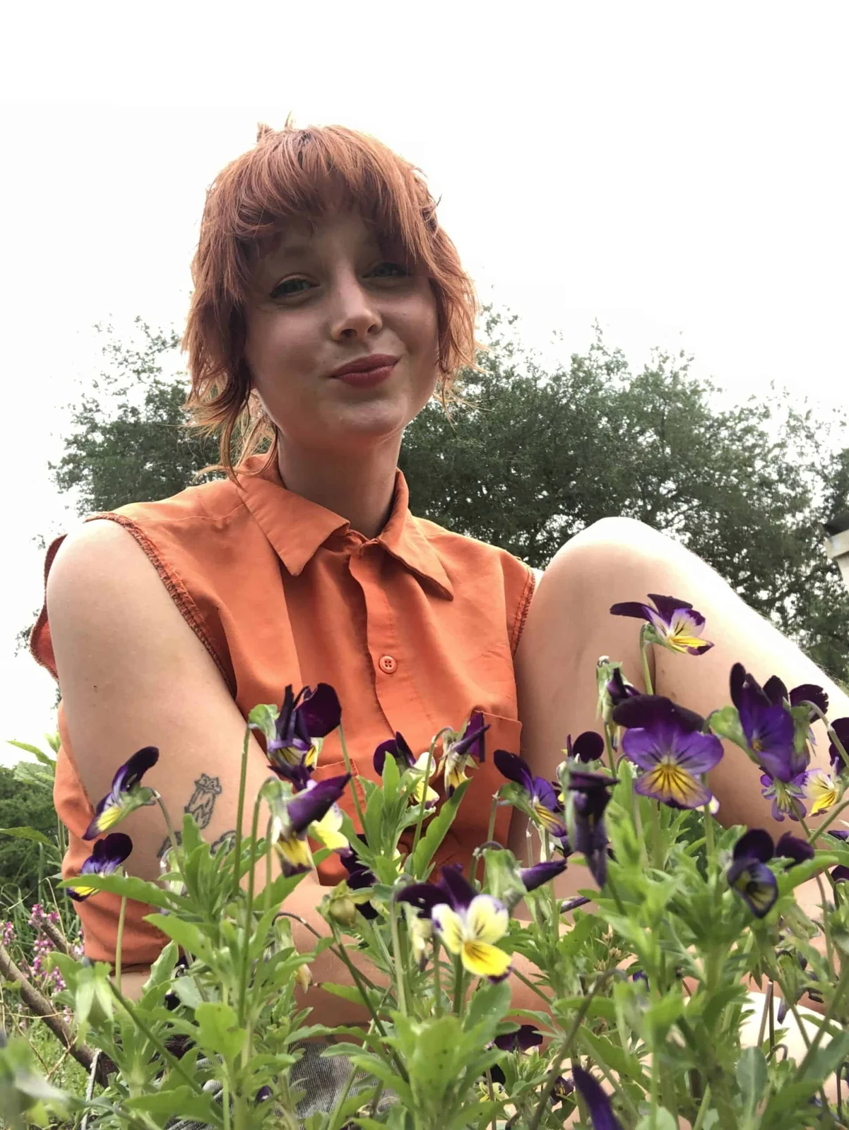 Maypop herbalist Cate Alber pictured among flowers